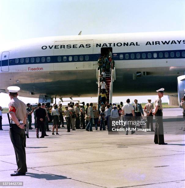 Vietnamese refugees arrive at the air station after being evacuated from Saigon.