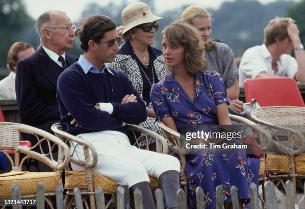 Charles, Prince of Wales, and Sabrina Guinness sitting together at an polo match in Windsor Great Park in Windsor, Berkshire, England, August 1979.