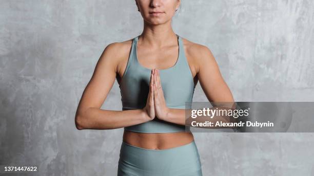 young yogi woman practicing yoga standing meditating - 良い姿勢 ストックフォトと画像