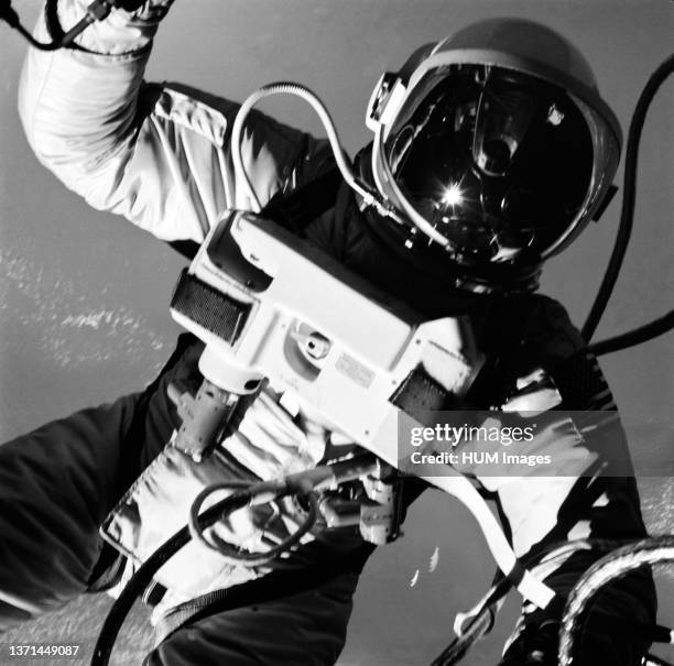 June 1965) Astronaut Edward H. White II, pilot on the Gemini-Titan IV spaceflight, floats in the zero gravity of space outside the Gemini IV...