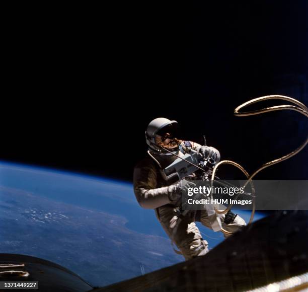June 1965) Astronaut Edward H. White II, pilot on the Gemini-Titan 4 spaceflight, is shown during his egress from the spacecraft.