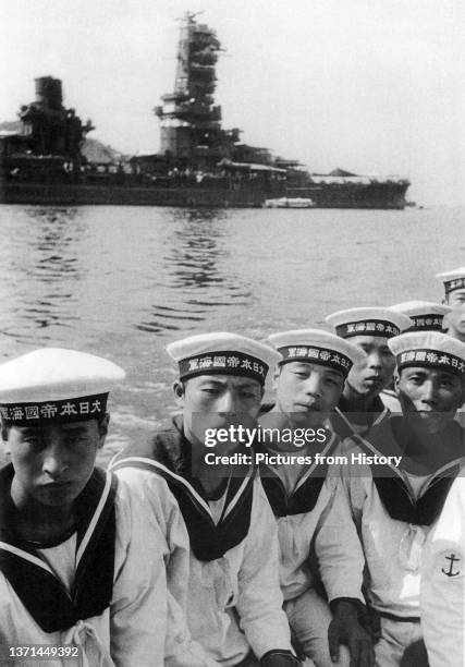 Crew members of the Japanese battleship Fuso moored in the background, Kure, Hiroshima, May 1943.