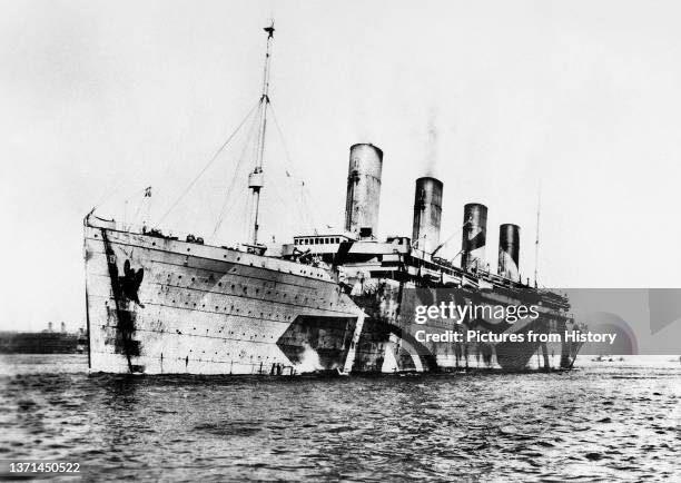 Olympic in dazzle camouflage while in service as a troopship during World War I, c. 1914-1918.