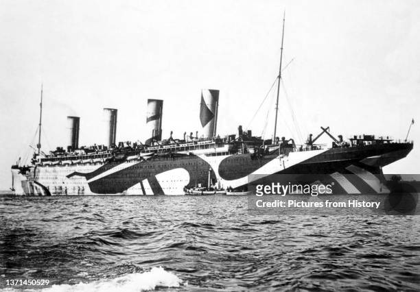 Olympic in dazzle camouflage while in service as a troopship during World War I, c. 1914-1918.