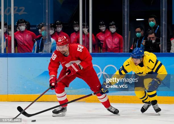 Anton Slepyshev of Team ROC and Henrik Tommernes of Team Sweden compete during the Men's Ice Hockey Playoff Semifinal match between Team ROC and Team...