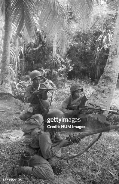 Three KNIL soldiers with different weapons at hand ; Date December 1948; Location Indonesia, Dutch East Indies, Sumatra.