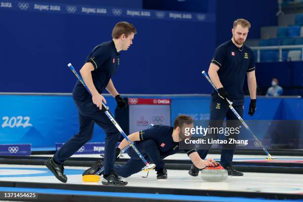 Christoffer Sundgren, Oskar Eriksson and Rasmus Wranaa of Team Sweden compete against Team Great Britain during the Men's Curling Gold Medal Game on...