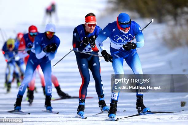 Maurice Manificat of Team France competes ahead of Andrew Musgrave of Team Great Britain during the Men's Cross-Country Skiing 50km Mass Start Free...