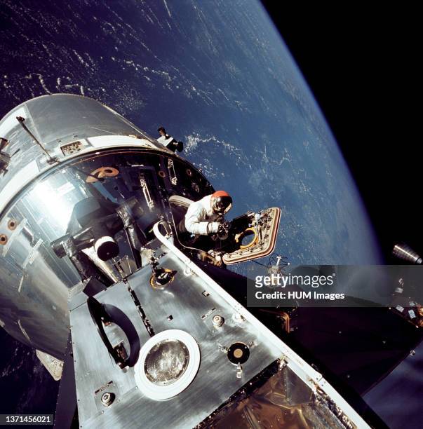 View of the docked Apollo 9 Command and Service Modules and Lunar Module , during astronaut David R. Scott's stand-up extravehicular activity , on...