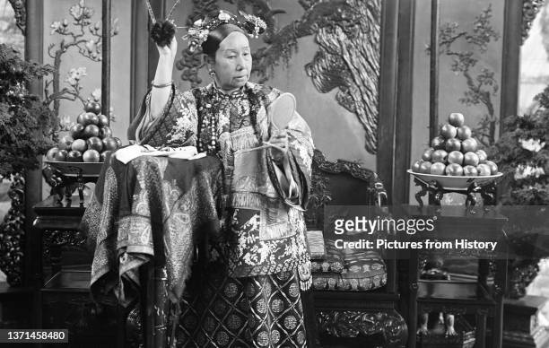 Official portrait of Empress Dowager Cixi by court photographer Yu Xunling, c. 1895.