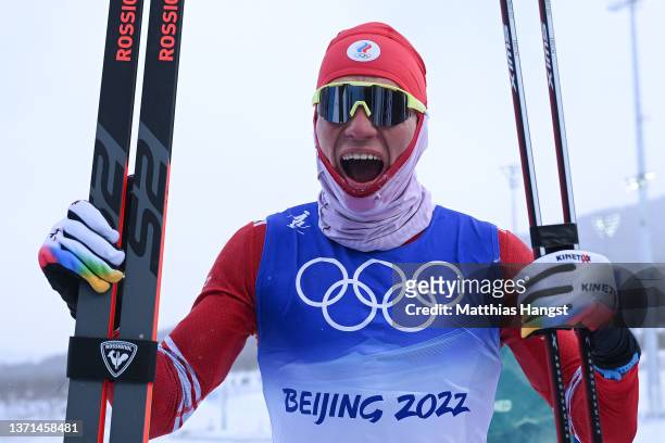Alexander Bolshunov of Team ROC celebrates winning the Gold medal during the Men's Cross-Country Skiing 50km Mass Start Free on Day 15 of the Beijing...