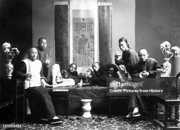 Studio portrait of opium smokers in China, Lai Afong, c. 1880.