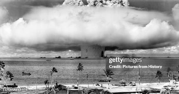 Mushroom-shaped cloud and water column from the underwater Baker nuclear explosion of July 25, 1946. Photo taken from a tower on Bikini Island, 3.5...