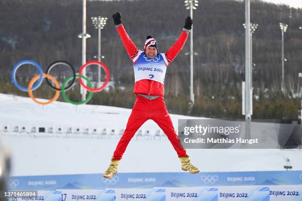 Gold medallist Alexander Bolshunov of Team ROC celebrates during the Men's Cross-Country Skiing 50km Mass Start Free flower ceremony on Day 15 of the...
