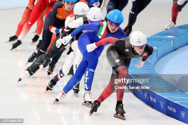 Ivanie Blondin of Team Canada skates ahead of Francesca Lollobrigida of Team Italy during the Women's Mass Start Final on day fifteen of the Beijing...