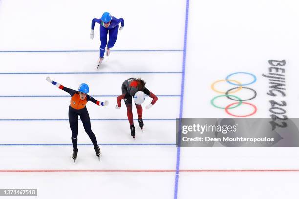 Irene Schouten of Team Netherlands crosses the finish line to win the Gold medal ahead of Ivanie Blondin of Team Canada and Francesca Lollobrigida of...