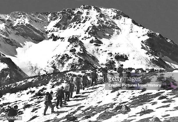 Communist troops of the 8th Route Army marching through the snowy mountains of the western Sichuan - Qinqhai borderlands during the Long March,...