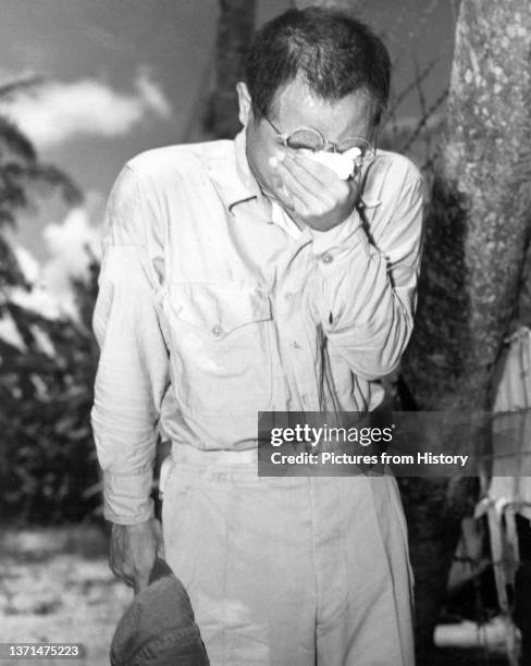 Japanese prisoner of war, captured on Guam, weeps after hearing Emperor Hirohito's surrender, August 15, 1945.