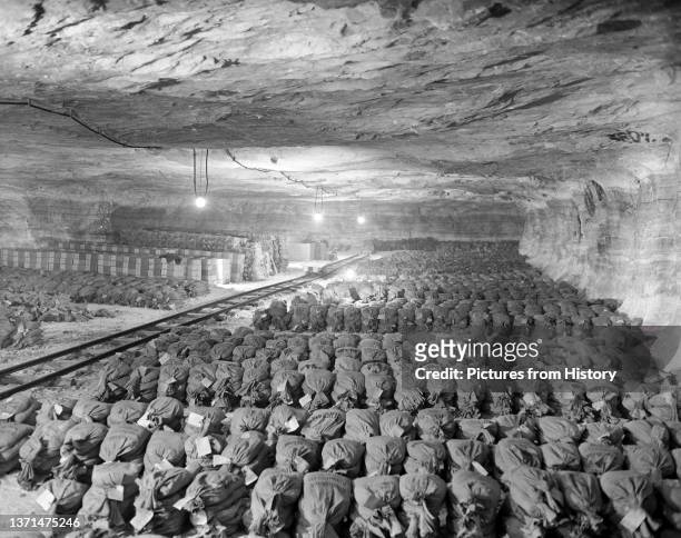 Hundreds of sacks of gold and other valuables concealed by the Nazis in the Merkers salt mine, Thuringia, 15 April, 1945.