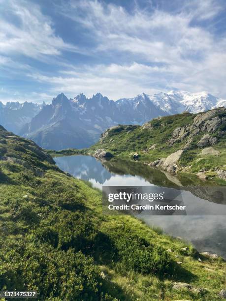 mirror lake with reflection and view of mont blanc massif | france - french alps summer stock pictures, royalty-free photos & images