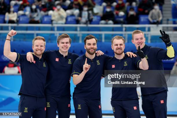 Niklas Edin, Christoffer Sundgren, Oskar Eriksson, Rasmus Wranaa and Daniel Magnusson of Team Sweden celebrate winning gold against Team Great...