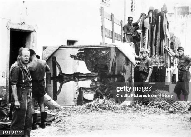 German soldiers unloading looted Florentine masterpieces including Luca Signorelli's 'Crucifixion' in Alto Adige, 13 August 1944.