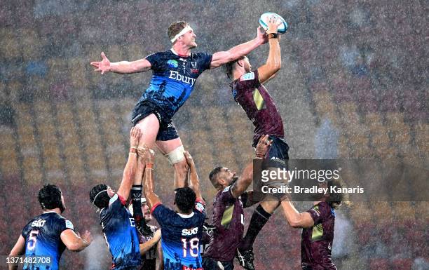 Angus Blyth of the Reds and Matt Philip of the Rebels compete at the lineout during the round one Super Rugby Pacific match between the Queensland...