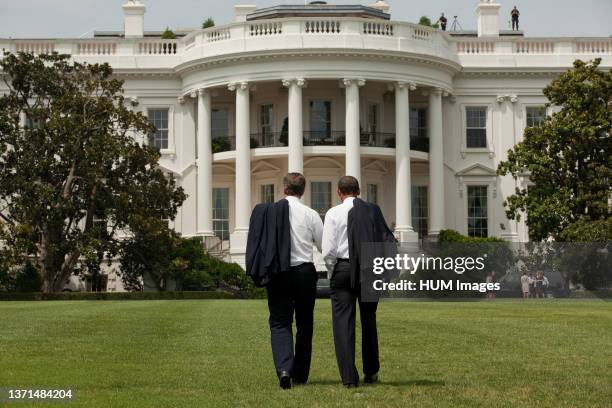 President Barack Obama and British Prime Minister David Cameron walk across the South Lawn of the White House, July 20, 2010..