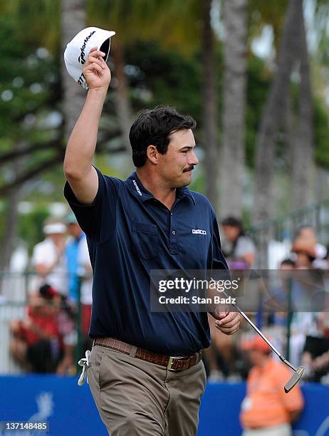 Johnson Wagner waves his cap to the gallery on the 18th green after winning the Sony Open in Hawaii at Waialae Country Club on January 15, 2012 in...