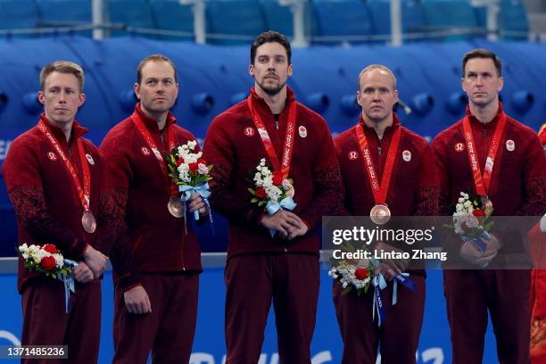 Bronze medallists Marc Kennedy, Geoff Walker, Brett Gallant, Mark Nichols and Brad Gushue of Team Canada look o during the Men's Curling Medal...