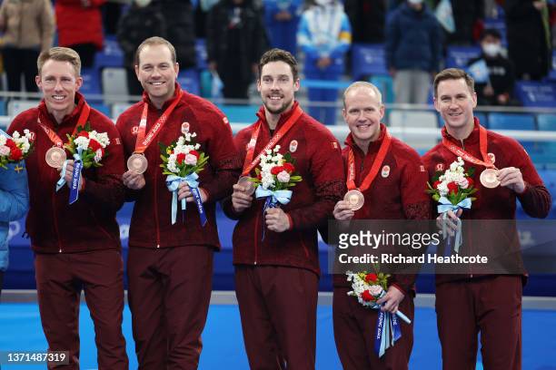 Bronze medallists Marc Kennedy, Geoff Walker, Brett Gallant, Mark Nichols and Brad Gushue of Team Canada look on during the Men's Curling Medal...