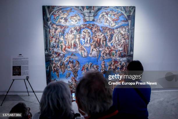 Several people look at the reproduction of the fresco 'The Last Judgment' by Michelangelo, at the exhibition on the Sistine Chapel, at the Moda...