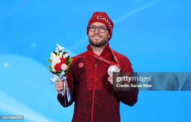 Silver Medallist Laurent Dubreuil of Team Canada poses with their medal during the Men's 1000m medal ceremony on Day 15 of the Beijing 2022 Winter...