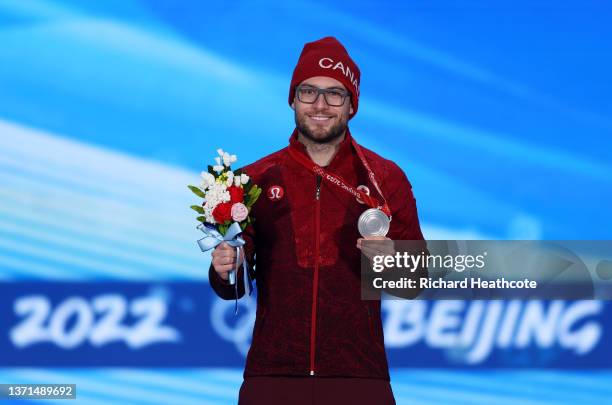 Silver Medallist Laurent Dubreuil of Team Canada poses with their medal during the Men's 1000m medal ceremony on Day 15 of the Beijing 2022 Winter...