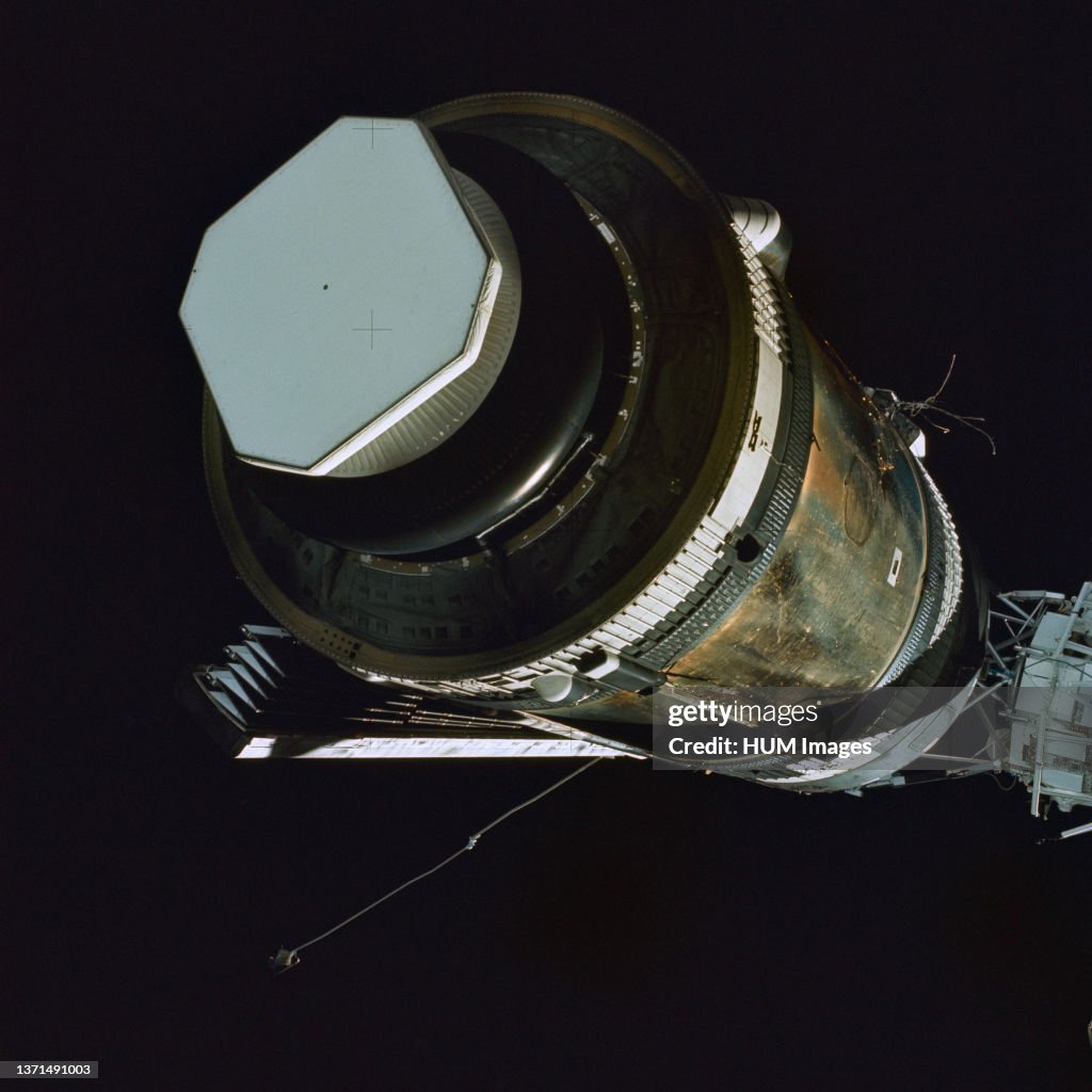 (25 May 1973) --- Skylab 2, approach to Skylab at long range, fly-around inspection. Orbital Workshop with area of missing shield visible and partially deployed solar array visible.