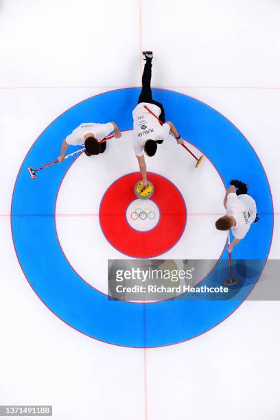 Grant Hardie, Hammy McMillan and Bobby Lammie of Team Great Britain compete against Team Sweden during the Men's Curling Gold Medal Game on Day 14 of...