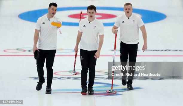 Hammy McMillan, Grant Hardie and Bobby Lammie of Team Great Britain compete against Team Sweden during the Men's Curling Gold Medal Game on Day 14 of...