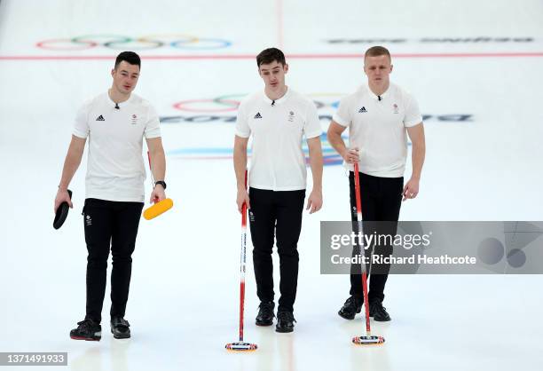 Hammy McMillan, Grant Hardie and Bobby Lammie of Team Great Britain compete against Team Sweden during the Men's Curling Gold Medal Game on Day 14 of...