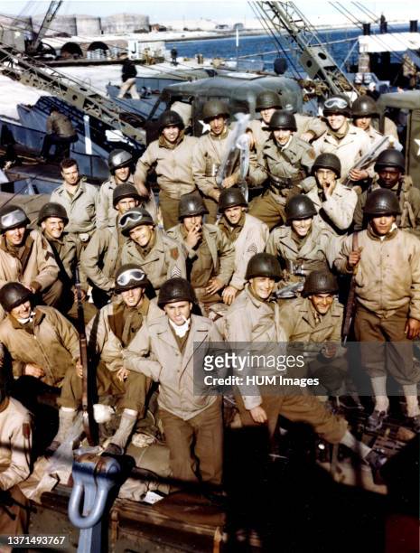 These American troops have loaded their equipment onto an LCT and are waiting the signal for the assault against the Continent.