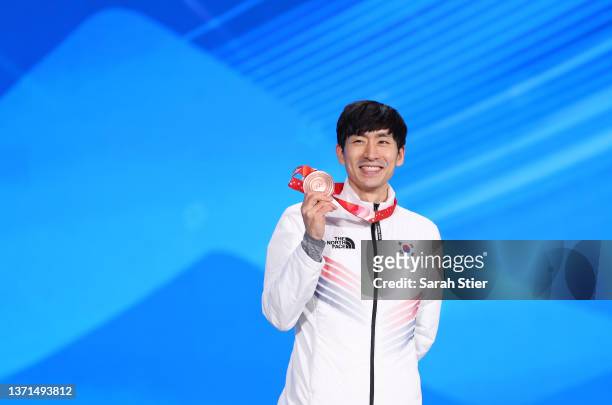 Bronze Medallist Seung Hoon Lee of Team South Korea poses with their medal during the Men's Mass Start medal ceremony on Day 15 of the Beijing 2022...