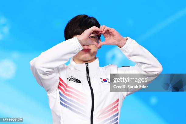 Silver Medallist Jae Won Chung of Team South Korea celebrates during the Men's Mass Start medal ceremony on Day 15 of the Beijing 2022 Winter Olympic...