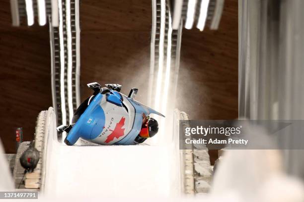 Cynthia Appiah and Dawn Richardson Wilson of Team Canada crash during the 2-woman Bobsleigh Heat 3 on day 15 of Beijing 2022 Winter Olympic Games at...