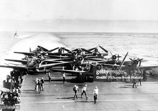 Torpedo bombers on the deck of USS Enterprise before launching an attack against four Japanese carriers in the Battle of Midway, 4 June, 1942. The...