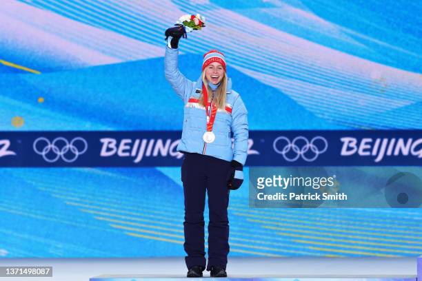 Silver medallist Tiril Eckhoff of Team Norway poses with their medal during the Women's Biathlon 12.5km Mass Start medal ceremony on Day 15 of the...