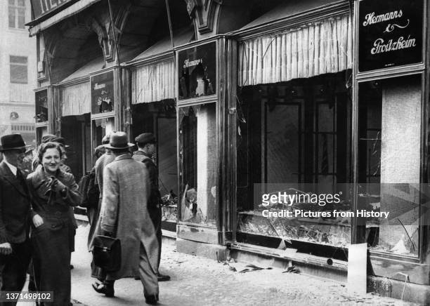 Shattered storefront of a Jewish-owned shop destroyed during Kristallnacht, Berlin, 1938. Photo by George Pahl .