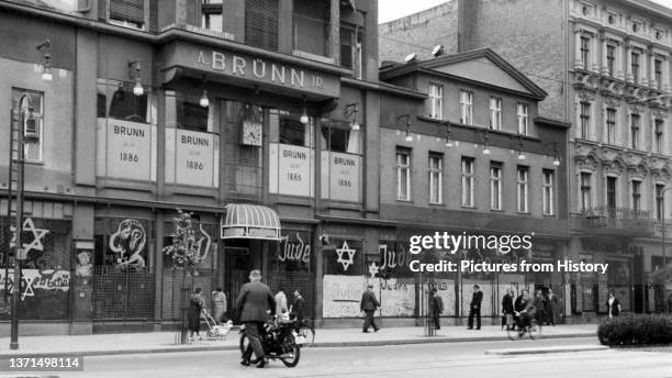 Jewish-owned shop after being vandalized by Nazis and covered with anti-Semitic graffiti, 1938.