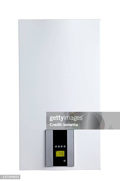 thermostat on plain white wall - home water heater stock pictures, royalty-free photos & images