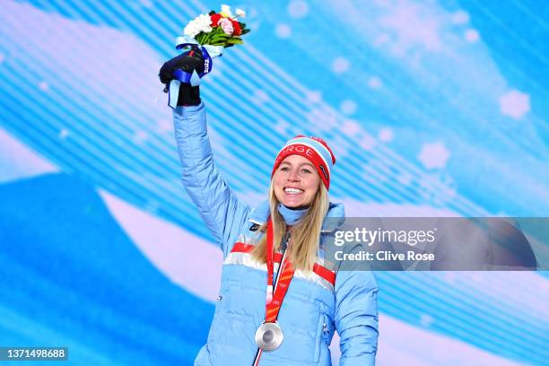 Silver medallist Tiril Eckhoff of Team Norway poses with their medal during the Women's Biathlon 12.5km Mass Start medal ceremony on Day 15 of the...