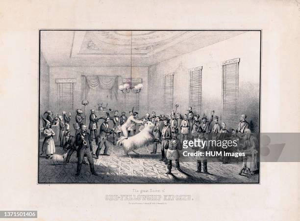 Print shows the interior of a room during an initiation ceremony with a naked man kneeling on the back of a goat while holding on to its horns, a man...