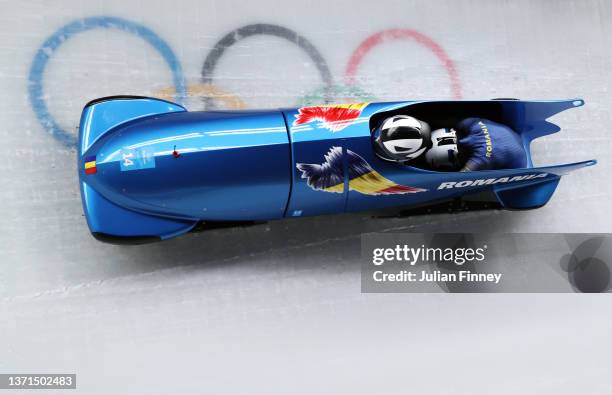 Andreea Grecu and Katharina Wick of Team Romania slide during the 2-woman Bobsleigh Heat 3 on day 15 of Beijing 2022 Winter Olympic Games at National...